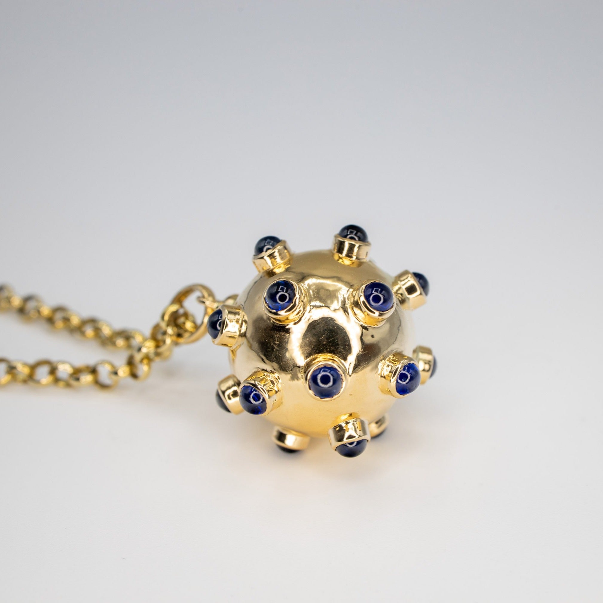 Bomb pendant with sapphire Cabochons