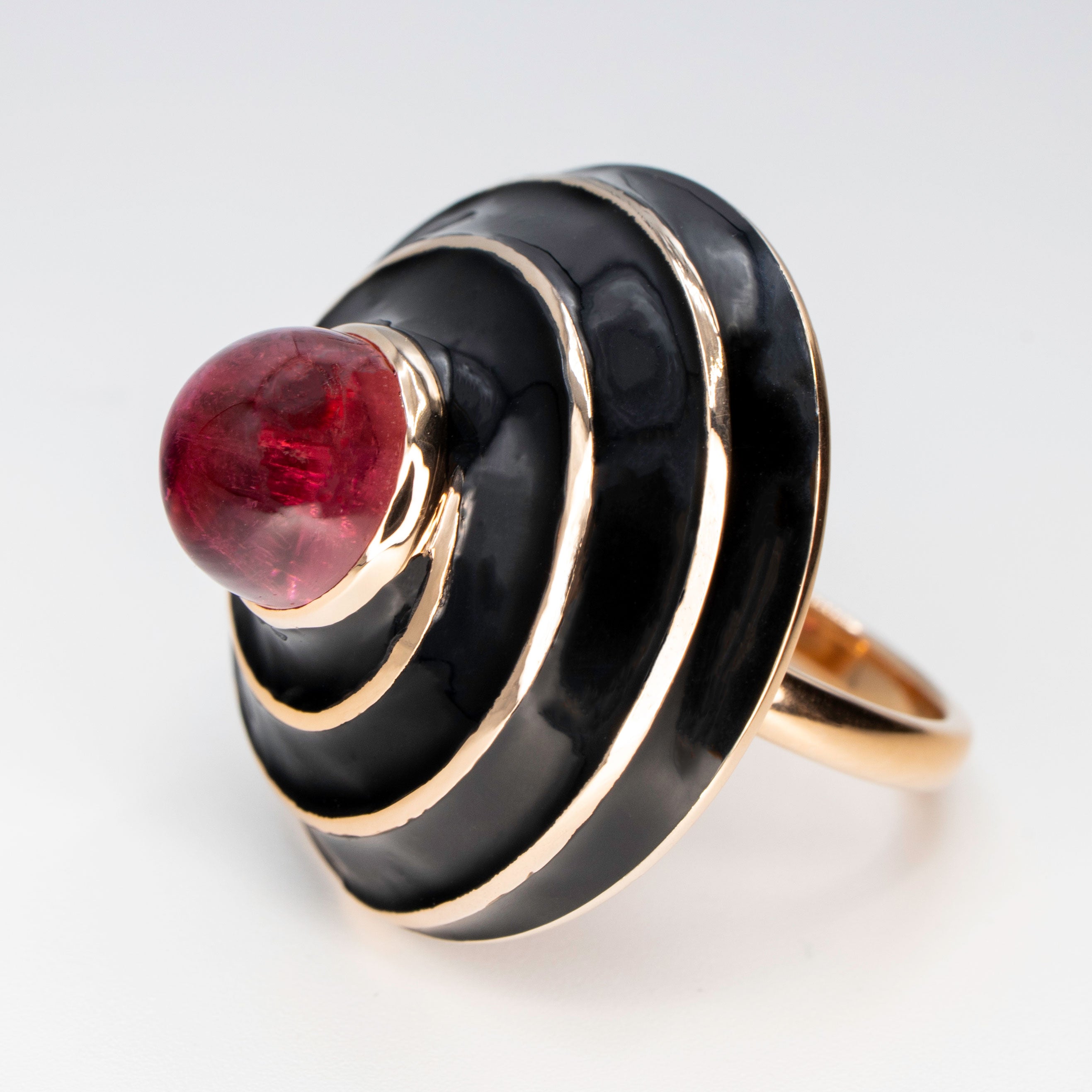 A Rubellite cabochon & black enamel ring