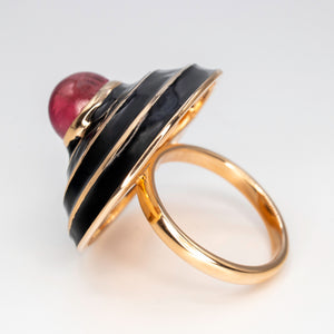 A Rubellite cabochon & black enamel ring