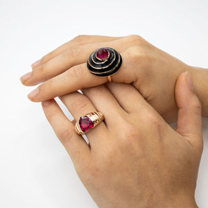 A Rubellite cabochon & black enamel ring